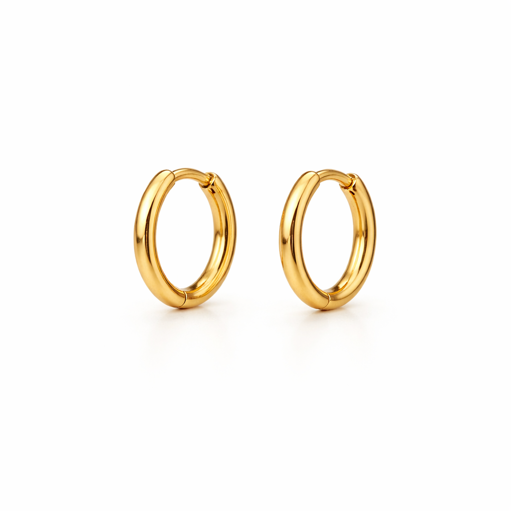 Gold hoop earrings on a white background