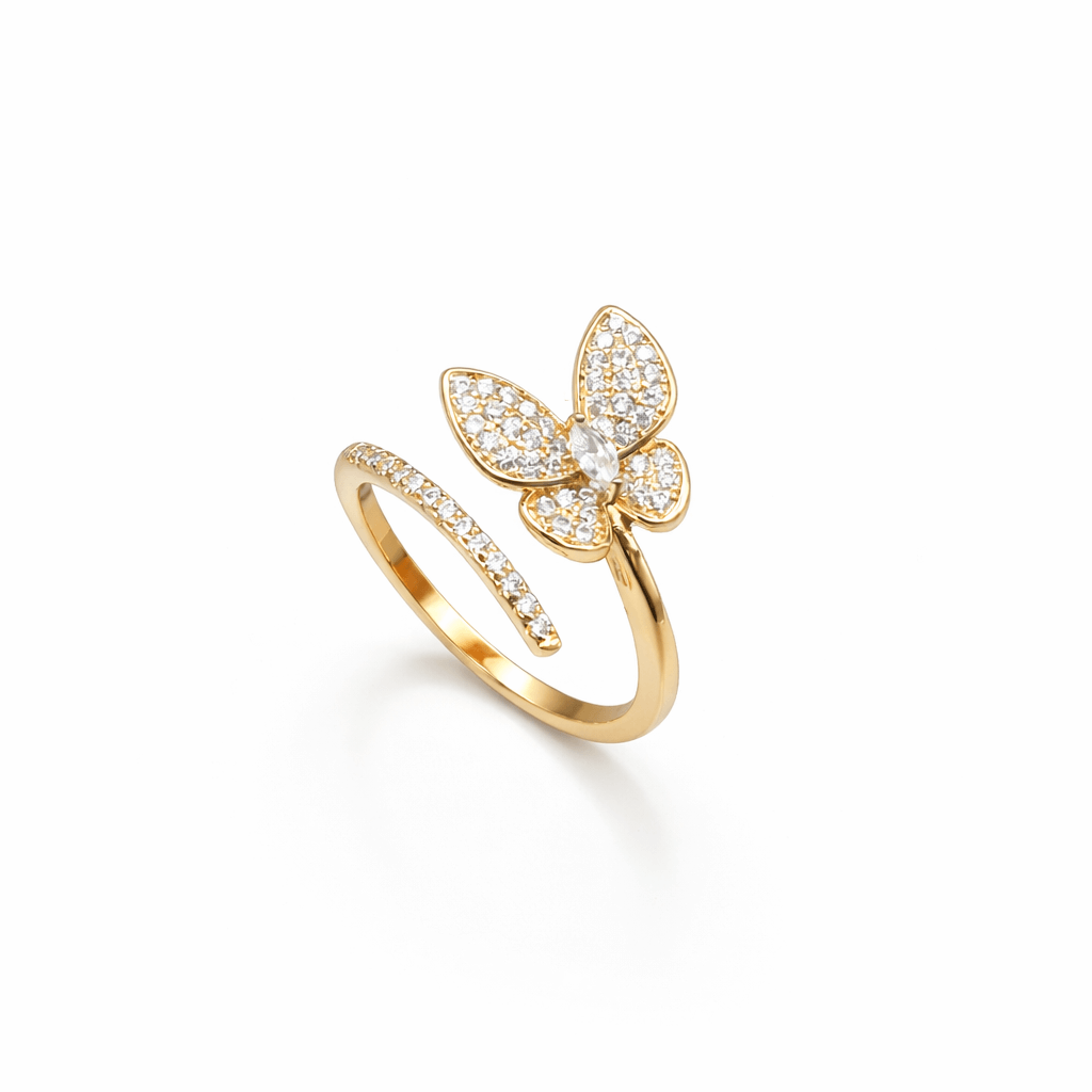 Gold butterfly ring with diamond accents on a white background