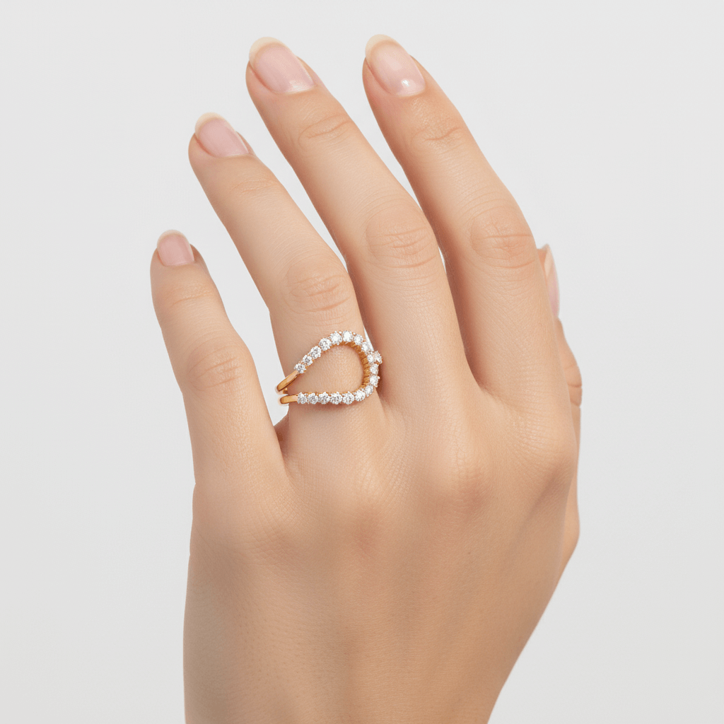 Gold open ring with white zircon stones on a models hand