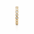 Gold eternity band with white stones