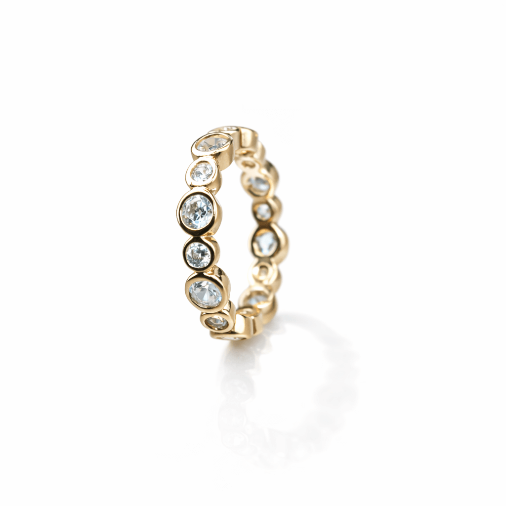 Gold eternity band with white stones