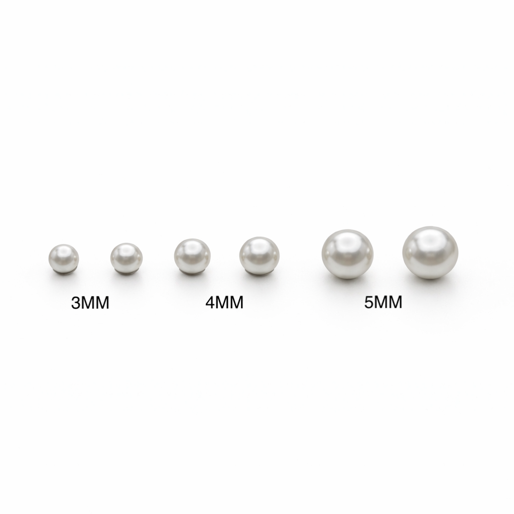 Set of pearls with labeled sizes on a white background