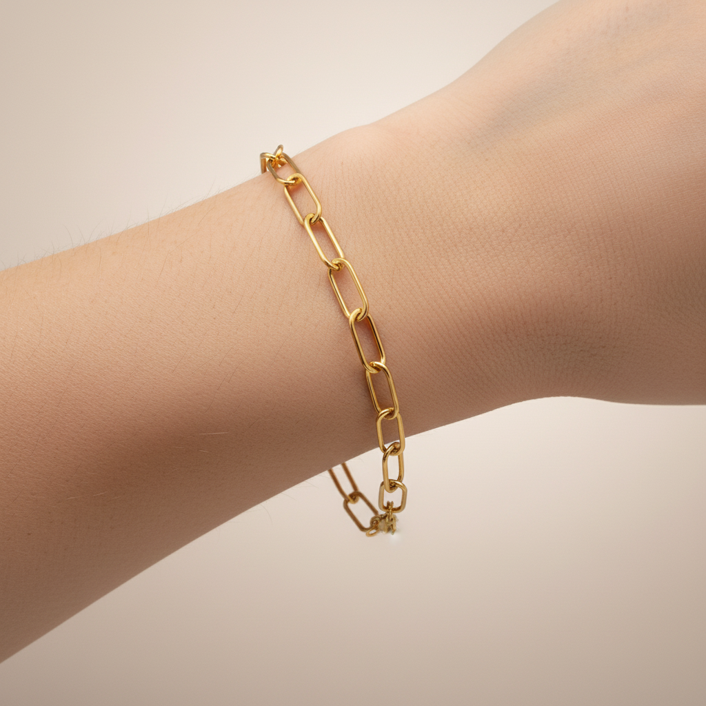 Gold chain bracelet on a white background