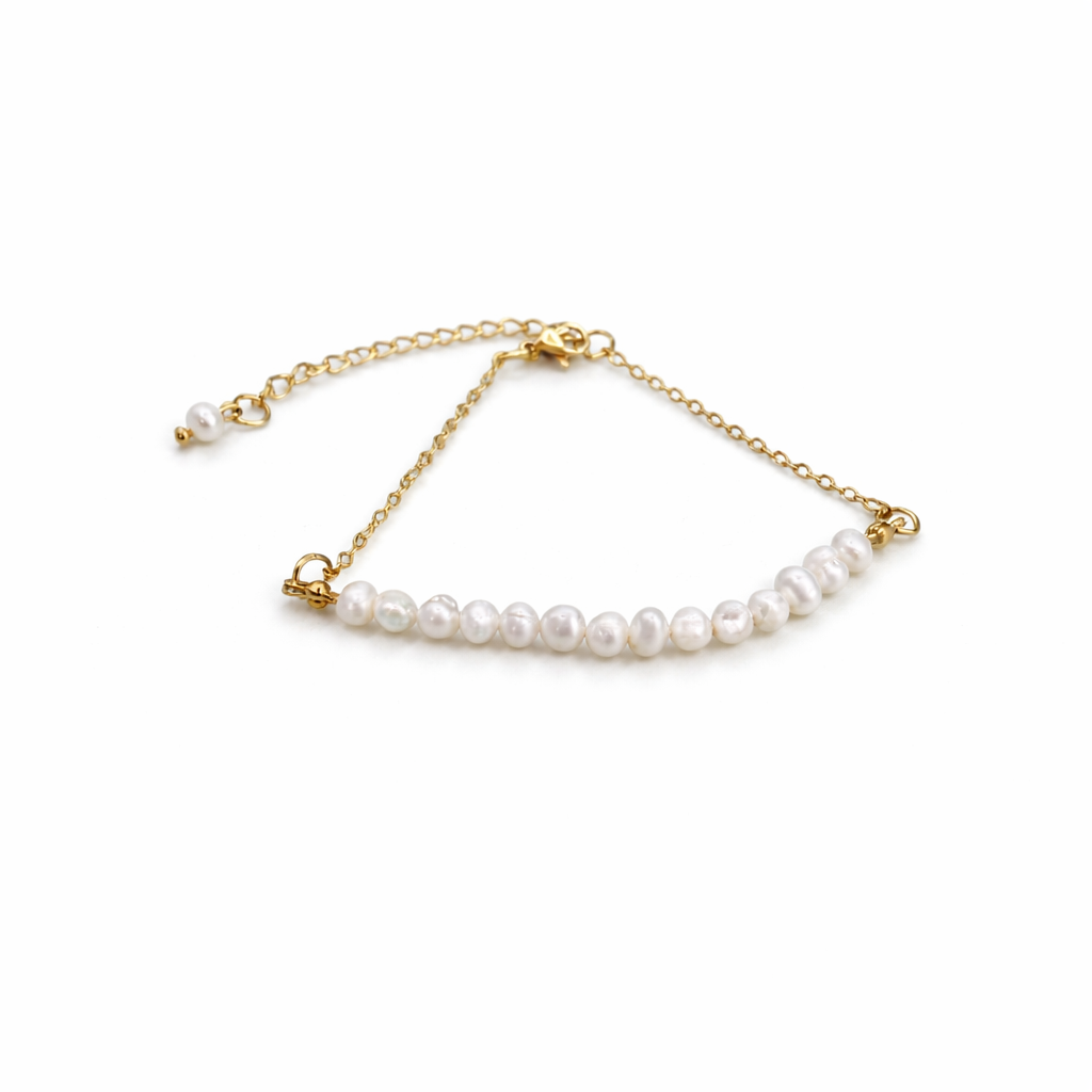 Pearl bracelet with gold chain on a white background