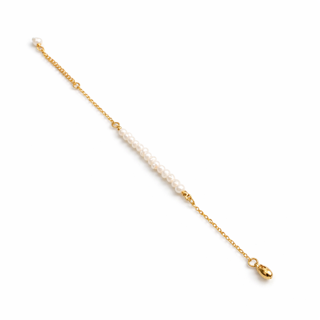 Gold chain with pearls on a white background